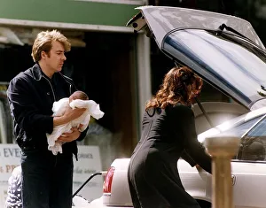 Jonathan Ross TV Presenter with wife Jane Ross holding new baby