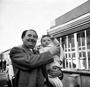 00021 Prints: Joseph Locke, famous tenor helps his six month old son Prince, to wave goodbye to his mum