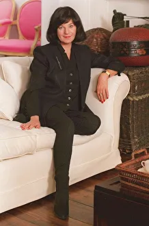 JOSEPHINE HART WIFE OF MAURICE SaTCHI SITTING ON A SOFA 08 / 06 / 1995