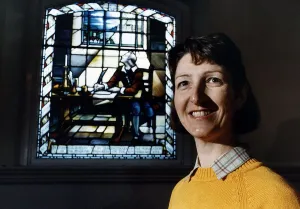 Middle East Prints: Joy Brodier standing infront of a stained church window this is the picture th at she
