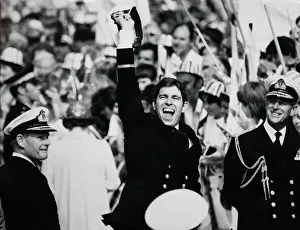 00280 Prints: Jubilant Prince Andrew ashore with proud father Prince Philip after the carrier HMS