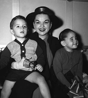 Judy Garland with her children Joe and Lorna at the Savoy Hotel in London 1957