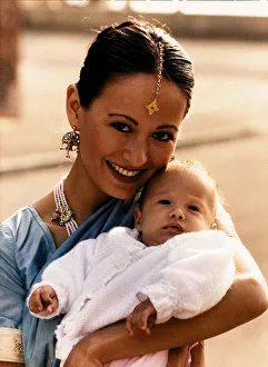 And Child Prints: Julia Nickson-Soul wife of actor David Soul holding their daughter China August