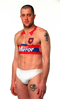 Julian Dicks of West Ham has a Daily Mirror football kit painted on to his body during
