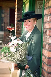 Julie Goodyear is pictured outside The Rovers Return on the set of Coronation Street