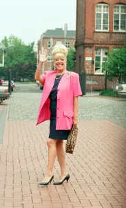Julie Goodyear is pictured outside the set of Coronation Street greeting fans
