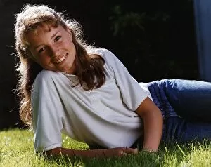 Images Dated 4th December 1992: Juliette Carton actress wearing jeans lying in grass