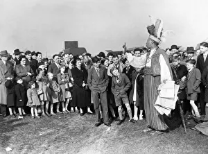 Jump Sunday, Aintree. Colourfull tipster Prince Monolou charms a crowd of spectators who
