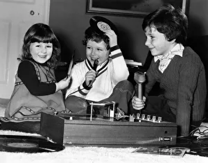 Junior DJ s, children of Disc Jockey Terry Wogan have some fun playing together