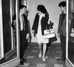 Junior Leeds United players Terry Hibbit (left) and Michael Bates hold the door open for
