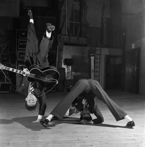 Its just part of their novel dance routine. They are the Nelson Brothers who dance