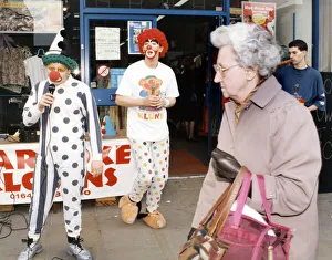 00533 Prints: Karaoke clowns Peter Watson (right) and Stephen Brooks entertain shoppers in Stockton