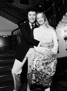 Karen Dotrice Actress and Robert Powell Actor sitting on bannister rail at the bottom of