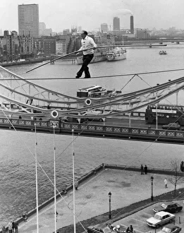 Stuntman Prints: Karl Wallenda successfully walks 100 feet above the ground near Tower Bridge