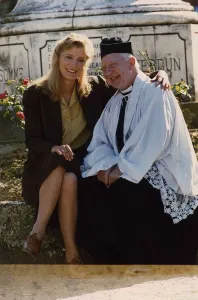 Occupation P Prints: Kate Buffery sitting on wall with Priest January 1989 Dbase