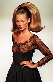1990s Fashion Prints: Kate Moss models a Guy Laroche design at the Paris fashion Show Very big hair