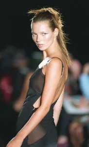 Kate Moss supermodel models Versace during Paris Fashion Week Black dress