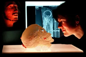 00187 Prints: Katherine Erimin National Museum Scientist March 1998 with resin model skull of a