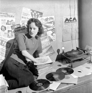 Kathleen Craig juke box queen who selects records for jukeboxes. 1956 A516-011