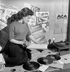 Kathleen Craig juke box queen who selects records for jukeboxes. 1956 A516-012