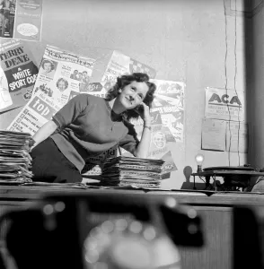 Kathleen Craig juke box queen who selects records for jukeboxes. 1956 A516