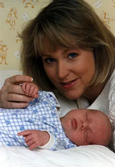 00126 Prints: Kathryn Holloway TV Presenter of UK Livings Agony Programme with baby son James Holloway
