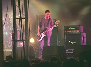 Keanu Reeves actor and musician guitarist with pop group Dogstar playing guitar on stage