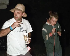 Keith Allen and son Alfie Allen singing Kareoke June 1999 at the Glastonbury
