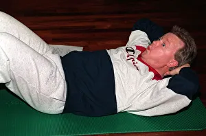 00145 Prints: Keith Chegwin TV presenter at health farm January 1994 doing sit-ups