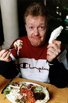 00126 Prints: Keith Chegwin TV Presenter spends a day at a health club eating at table