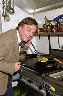 Frying Pan Prints: Keith Floyd Chef & TV Presenter prepares food in kitchen May 1991