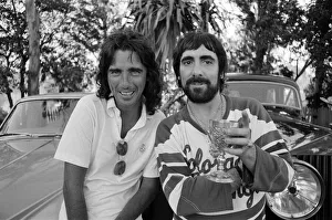 Keith Moon, drummer of The Who rock group and American rock star Alice Cooper pose with
