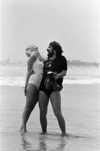 Keith Moon, drummer of The Who rock group with model Annette Lax in the resort of Malibu