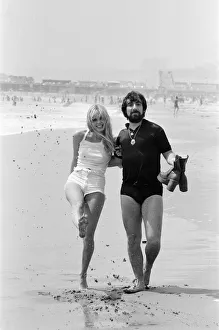 Keith Moon, drummer of The Who rock group with model Annette Lax in the resort of Malibu