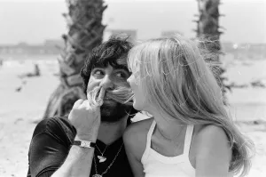 Keith Moon, drummer of The Who rock group with model Annette Lax in the resort of Malibu