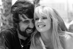 Keith Moon, drummer of The Who rock group with model Annette Lax in the resort of Malibu