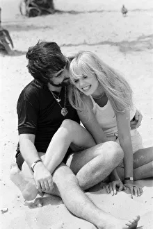 Keith Moon, drummer of The Who rock group with model Annette Lax in the resort of Malibu