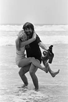 Keith Moon, drummer of The Who rock group with model Annette Lax in the resort of Malibu