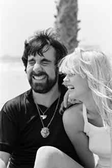 Keith Moon, drummer of The Who rock group with model Annette Lax in the resort of Malibu
