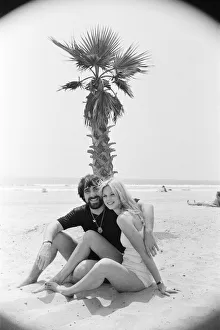 America Prints: Keith Moon, drummer of The Who rock group with model Annette Lax in the resort of Malibu