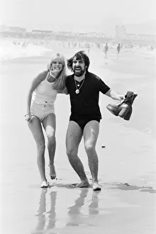 Keith Moon, drummer of The Who rock group with model Annette Lax in the resort of Malibu