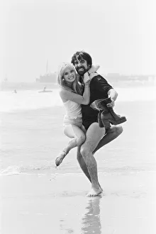 Keith Moon, drummer of The Who rock group with model Annette Lax in the resort of Malibu