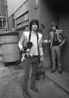 Keith Richards arrives at Coventry Theatre carrying a King Charles Spaniel under his arm