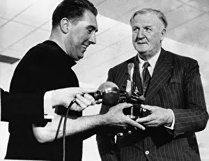Prize Prints: Ken Chisholm being presented with a trophy and prize money by Mr Cecil King