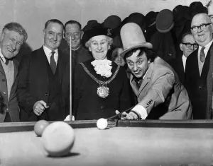 Ken Dodd - comedian from Liverpool. Ken plays snooker at The Knotty Ash
