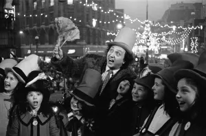 Lights Prints: Ken Dodd with his Diddymen after after switching on the Christmas lights in the centre of