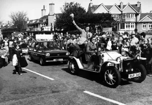 Feather Duster Prints: Ken Dodd leads a parade in Hoylake in aid the Clatterbridge Hospital Cancer Research