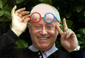 Ken Morley Actor who plays the part of Reg Holdsworth in Coronation Street holding up a