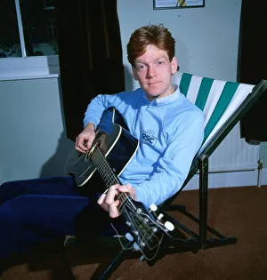 Kenneth Branagh actor director 1985 playing guitar