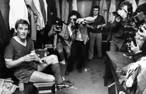 Photographers Prints: Kenny Dalglish celebrates with champagne in the dressing room as Liverpool win the league
